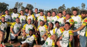 A group of men in green and yellow jerseys.