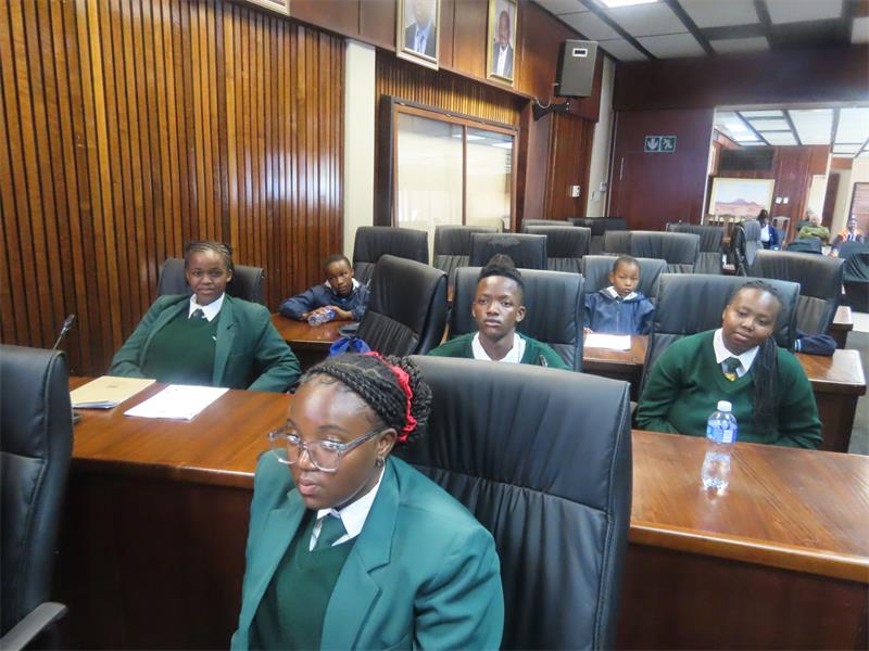 A group of students sitting in a classroom.