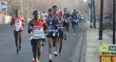 A group of runners are running in a marathon.