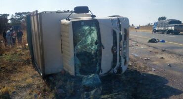 A truck that has been flipped over on its side.