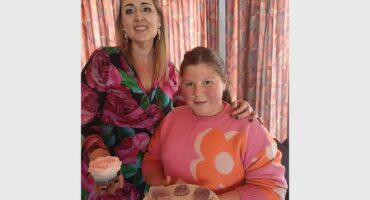 two women with cakes