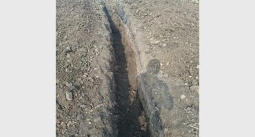 a long trench dug in the ground