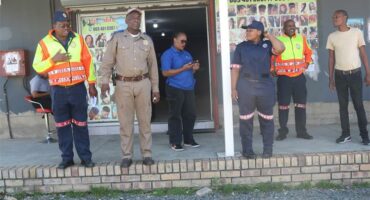 Law enforcement officers outside of an inspected business.