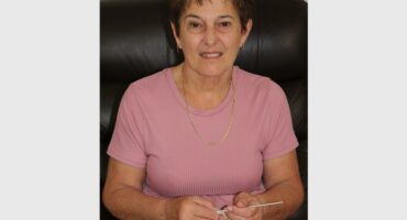 Woman in pink crochets