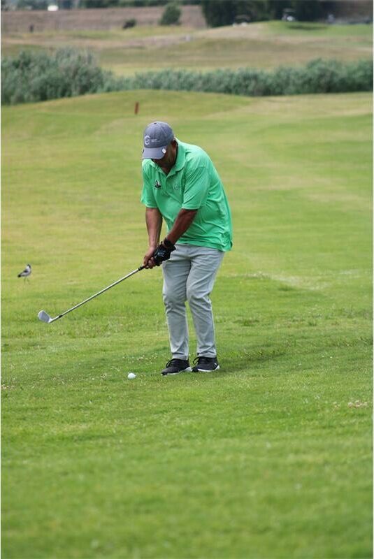 golfer plays on the greens