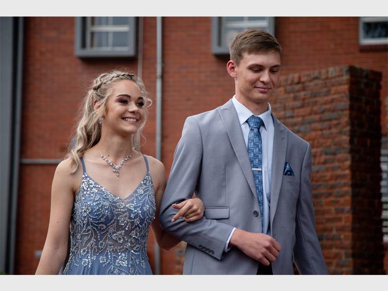 Couple with matching dress and tie.