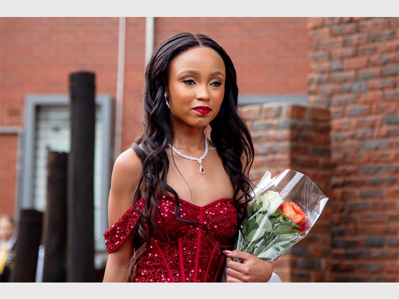 Pretty girl in red with flowers
