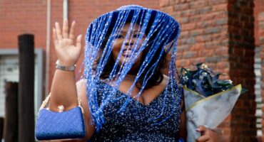 Girl dressed in blue with blue hat