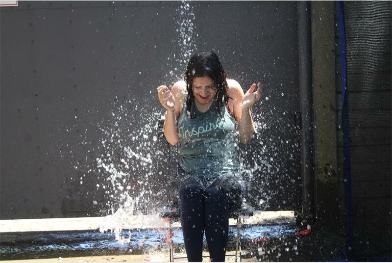 woman thrown with water