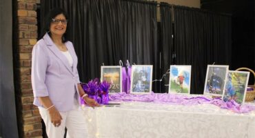 Woman by a table with books