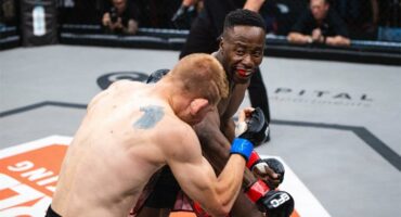 Two MMA fighters in the boxing ring.