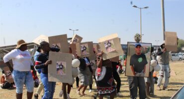 People picket outside the court.