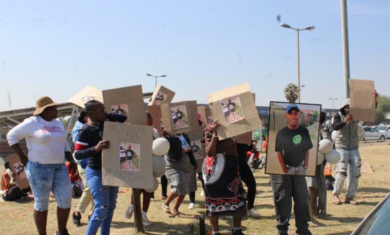 People picket outside the court.