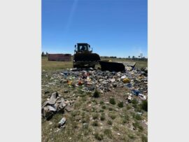 Heavy machinery is being used to clean up rubbish.