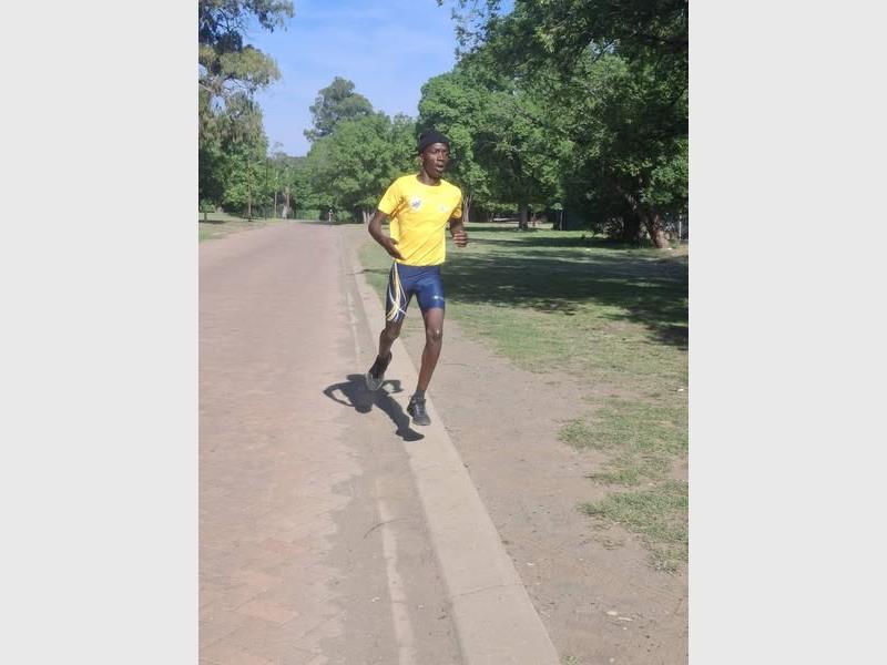 boy with bright yellow t-shirt runs
