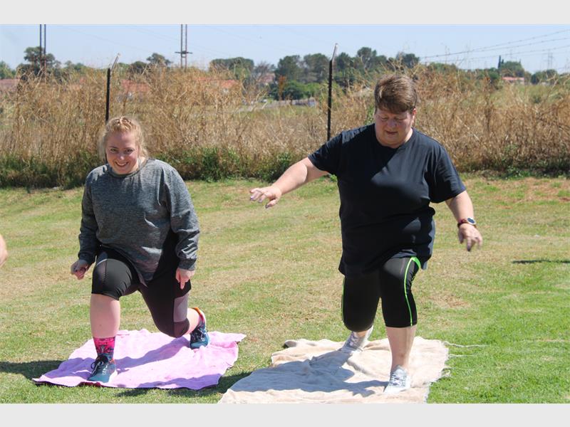two women stretches