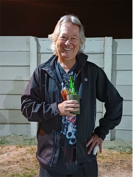 man with a drink in hand