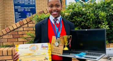 girl with a certificate and trophy