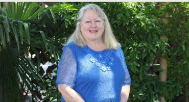 blonde woman in a blue dress