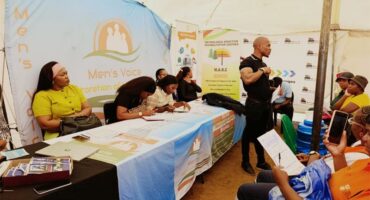 a man speak to a crowd