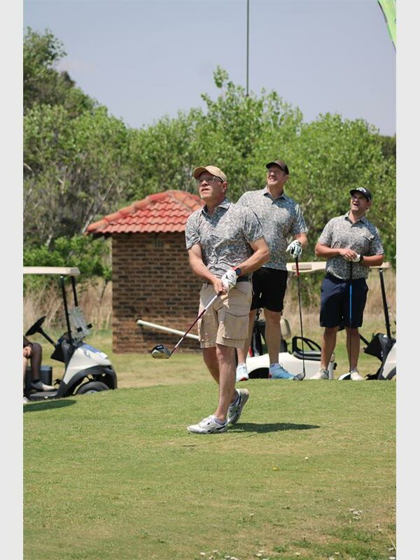 Golf players keep their eyes on the ball
