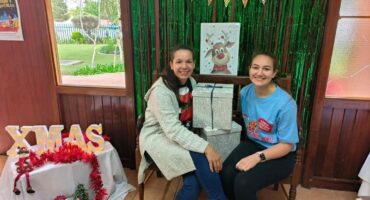 two women with a gift box