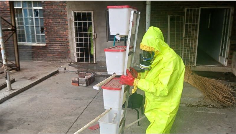 a person in yellow hazmat suit