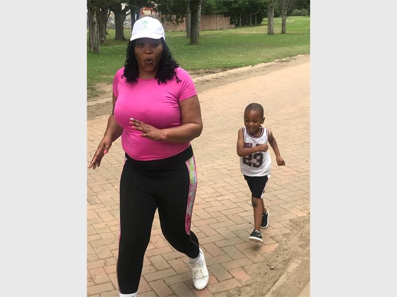woman and child running