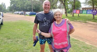 man and woman in running clothes