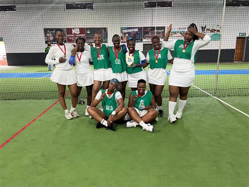 women sport team with medals