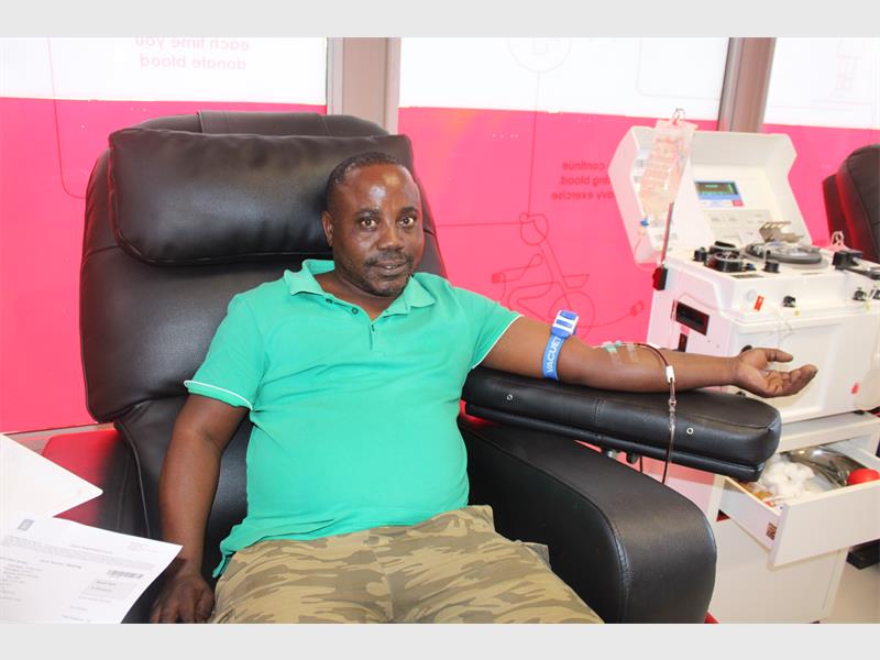 man donates blood