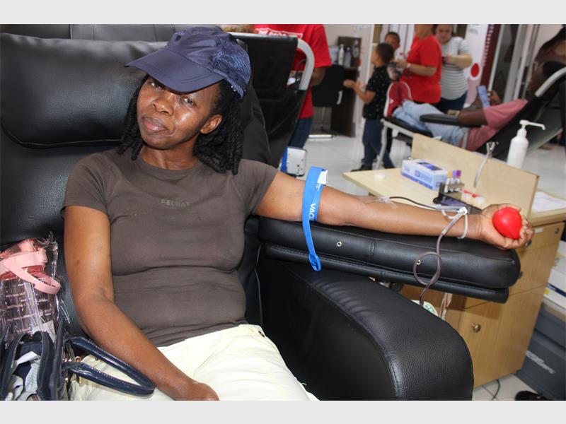 woman donates blood