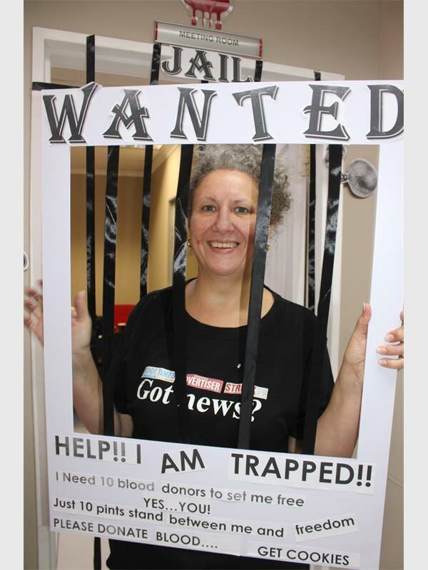 woman behind fake prison bars