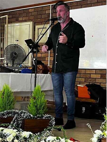 man sings on stage