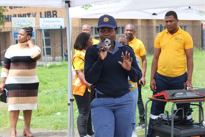police constable speaks over a microphone