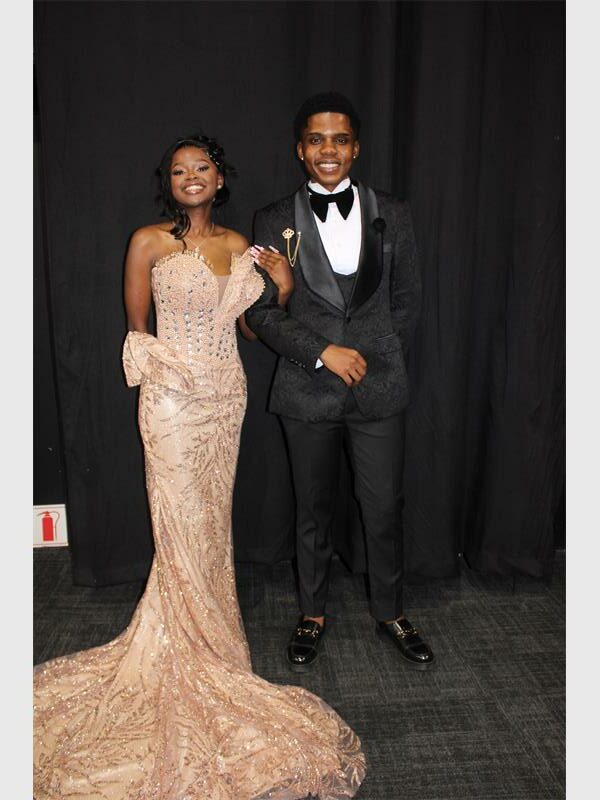 girl in stunning matric farewell dress wit her date
