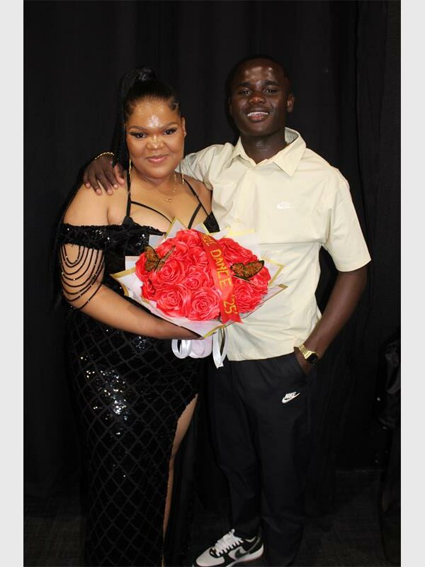 girl with flowers and young man
