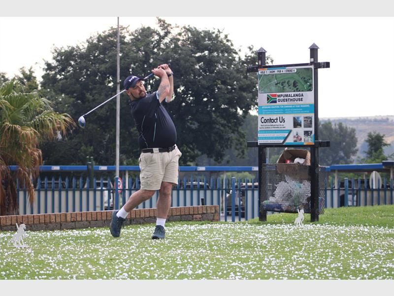 Golfer tees off