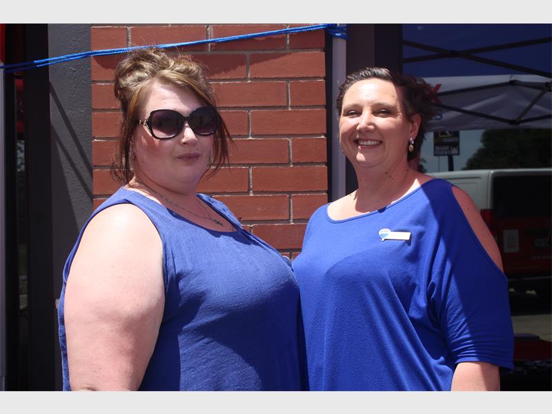 two women with blue shirts