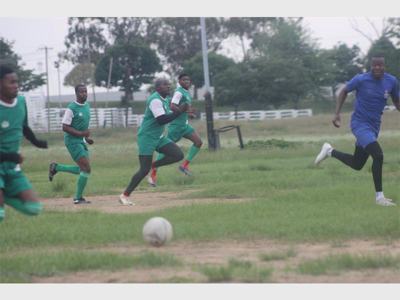 Players chase the ball.
