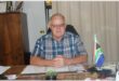 Charles Van Vuuren behind his desk.