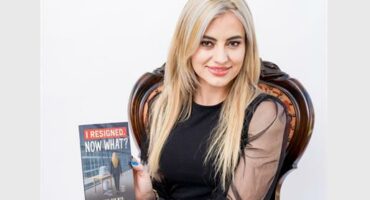 Blonde woman with a book in her hand