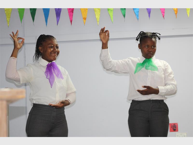 two deaf girls sign