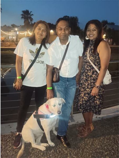 three women and a dog