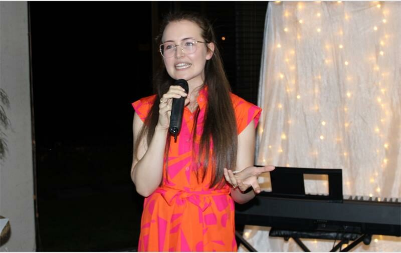 young woman in red with a keyboard in the background