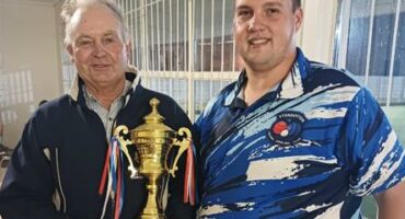 Two men with a trophy