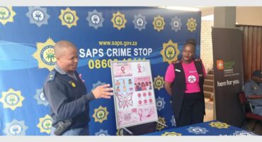 policeman and nurse with cancer poster