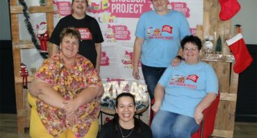 five people with boxes