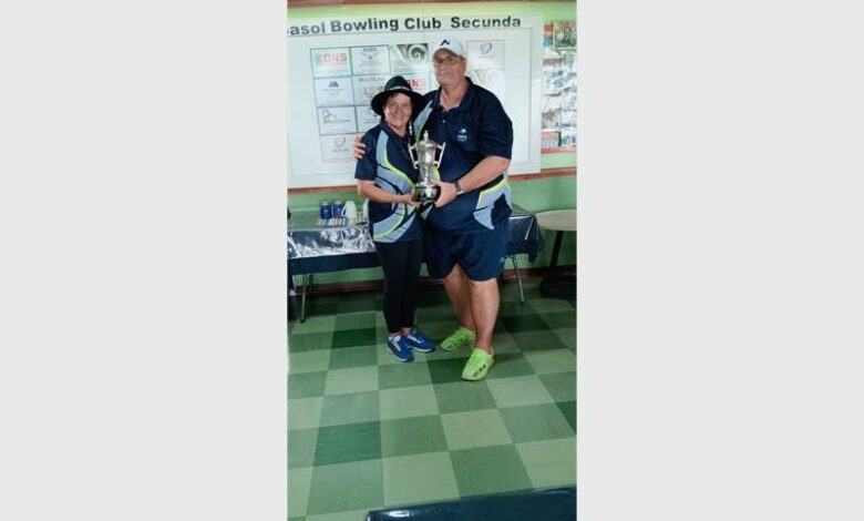 woman and man with trophy