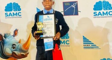 Boy with trophy and certificate